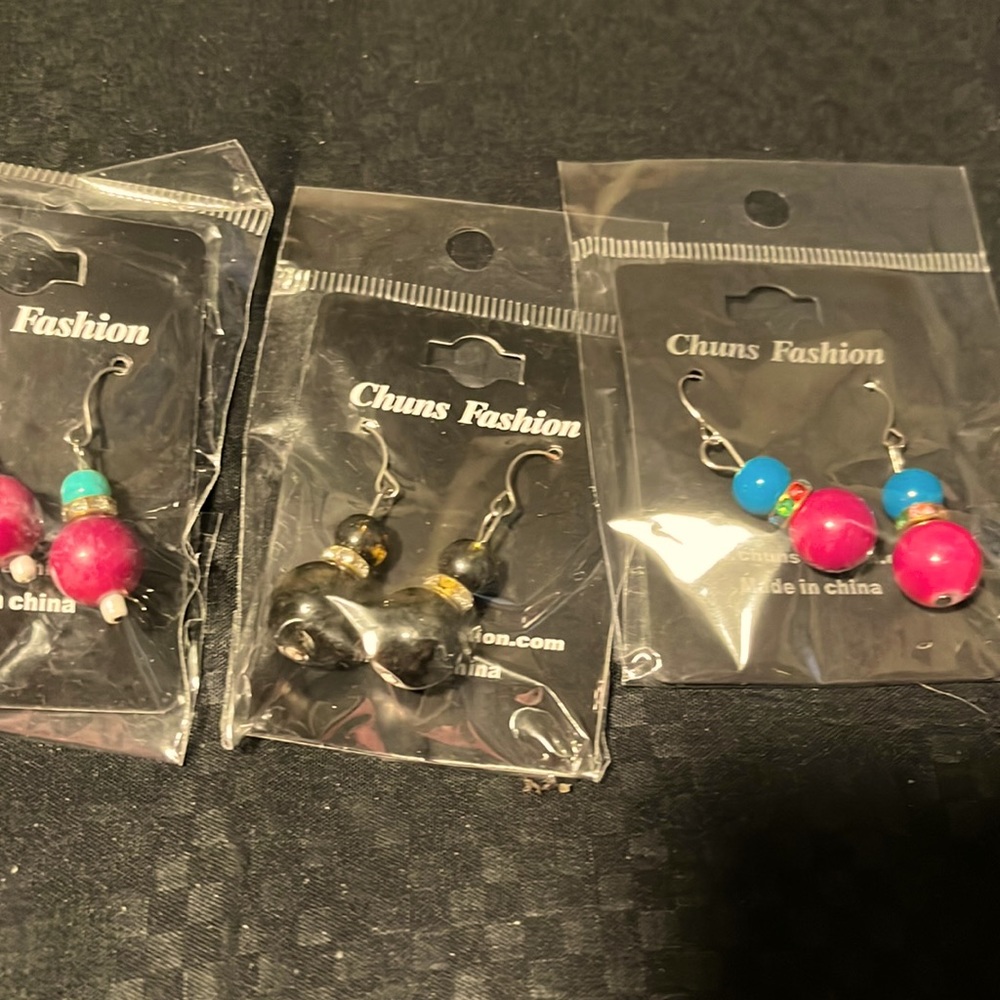 Assorted dangle earrings with rhinestone accents.